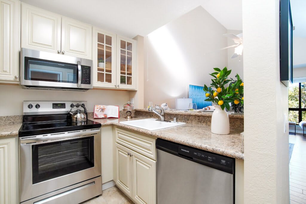 A modern and bright kitchen with sleek appliances and elegant decor.
