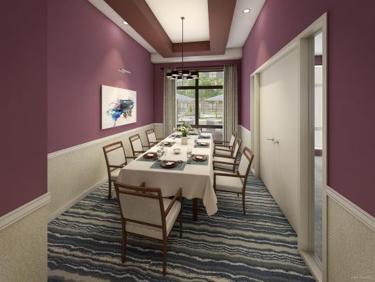 A modern dining room with purple walls and a neatly set table.