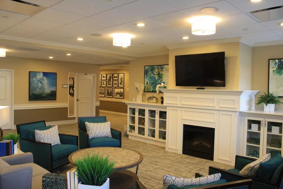 A cozy living room featuring a fireplace and comfortable seating.
