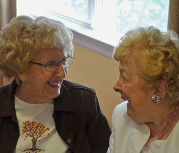 Two friends sharing a joyful moment together.