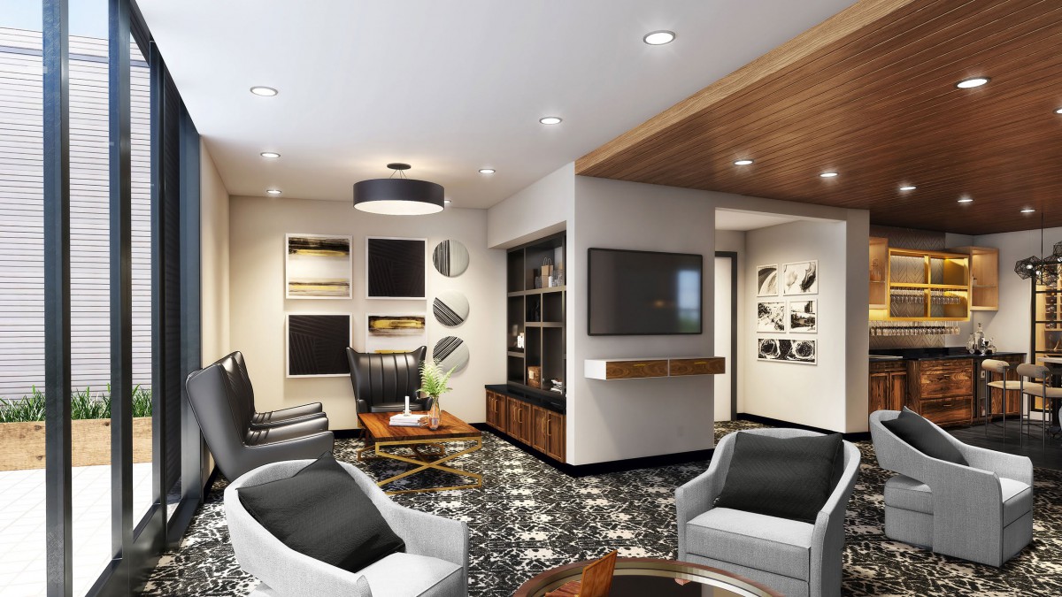 A modern living room featuring stylish furniture, contemporary artwork, and a sleek television setup.