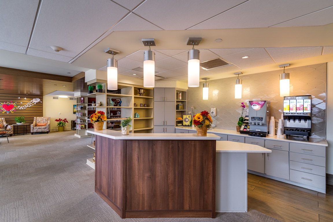 A modern office reception area with sleek lighting and decorative elements.