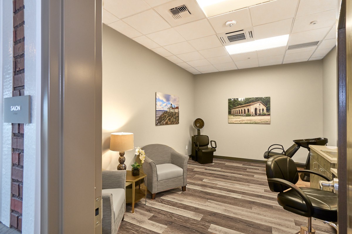 A cozy waiting room with comfortable chairs and calming decor.