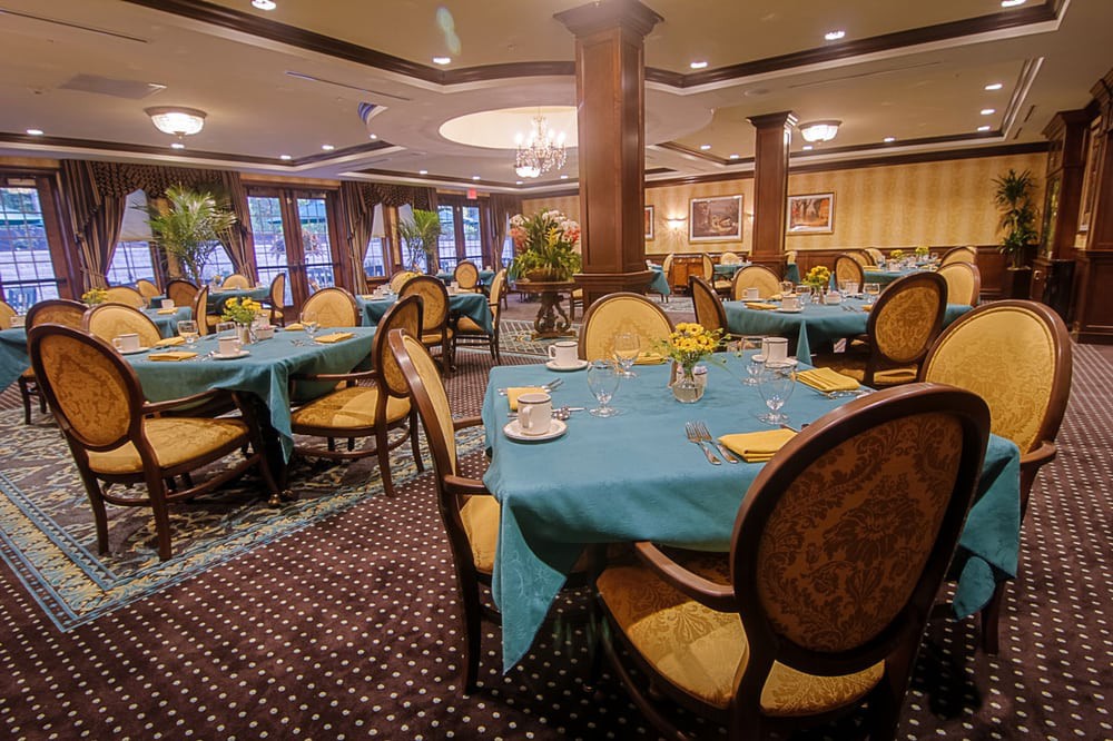 Elegant dining area with beautifully set tables and classic dcor.