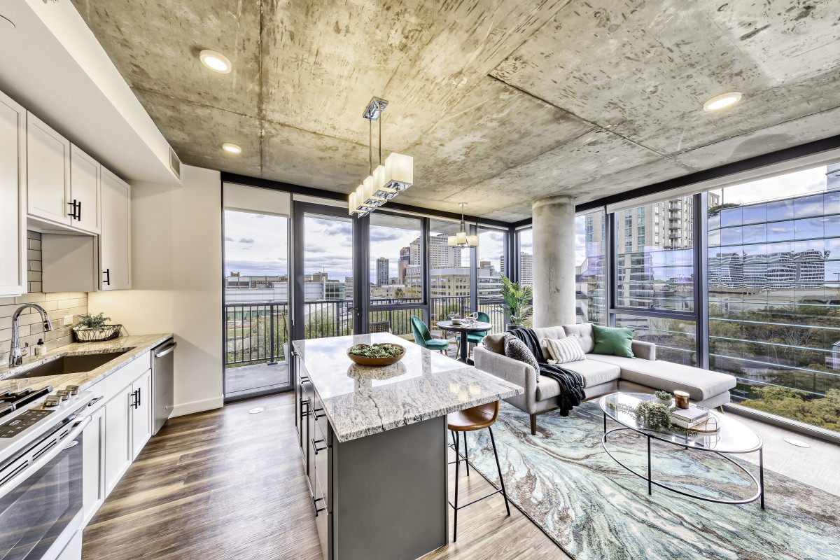 Stylish modern apartment with an open living area and stunning city views.