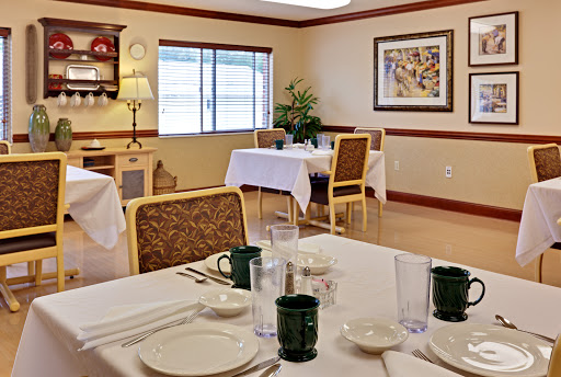 A cozy dining area featuring neatly arranged tables and a warm atmosphere.
