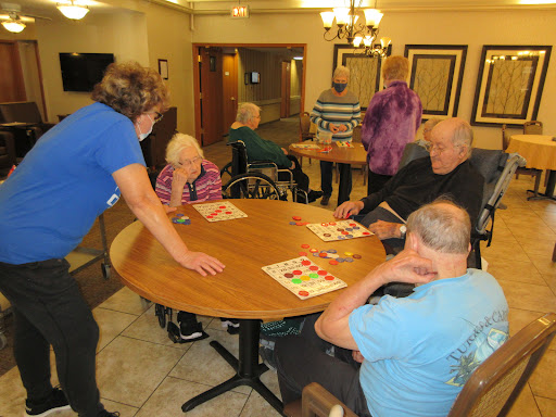 Residents enjoying a game together at a community center.