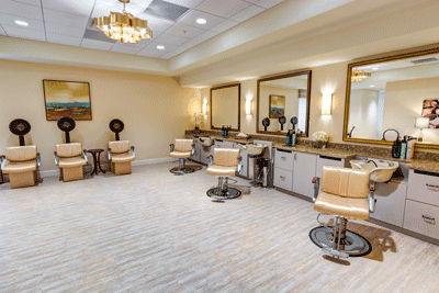 A modern salon interior featuring multiple styling chairs and mirrors, well-lit with chic lighting.
