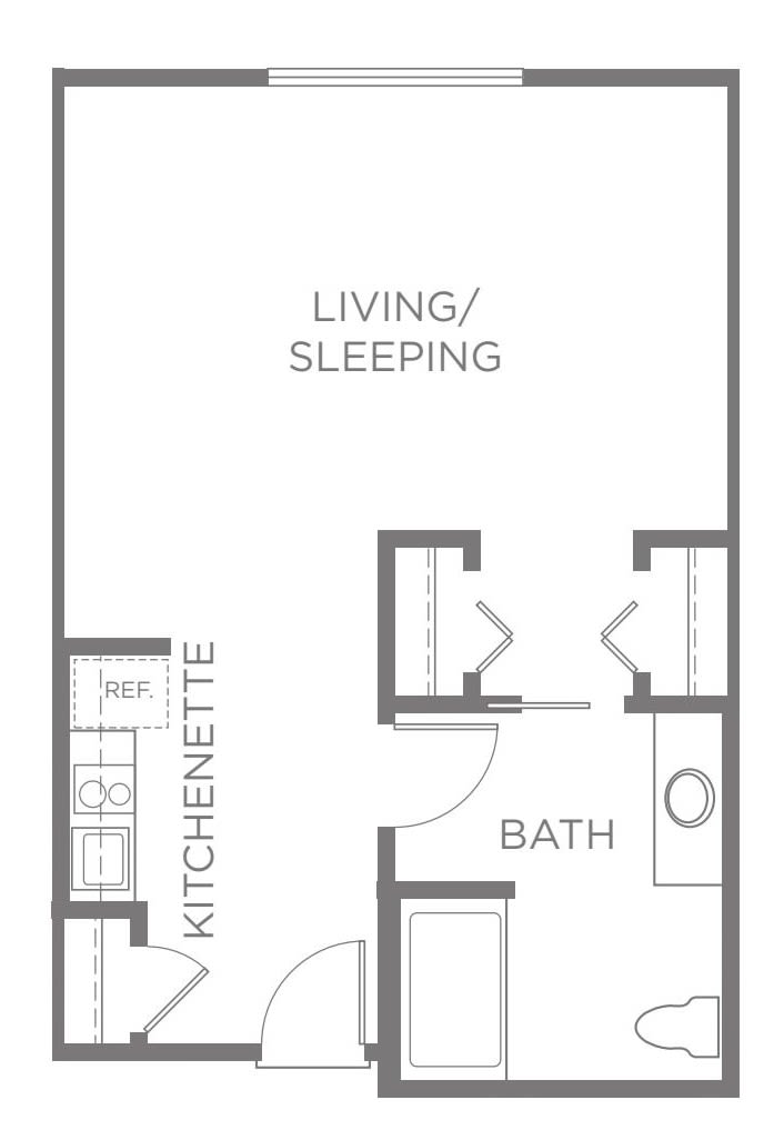 A floor plan of a studio apartment featuring a living/sleeping area, kitchenette, and bathroom.