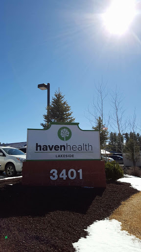 A sign for Haven Health located at 3401, under a clear blue sky.
