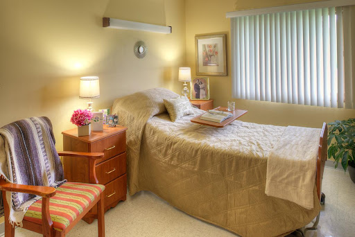 A cozy and inviting bedroom with warm lighting and simple decor.