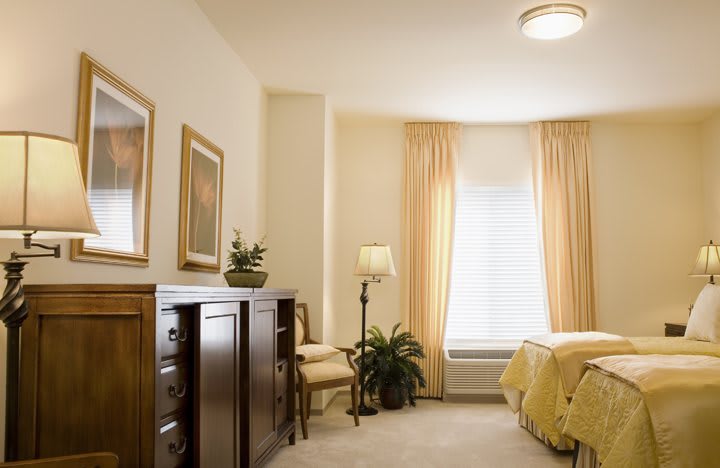 A cozy bedroom with warm lighting and elegant decor.
