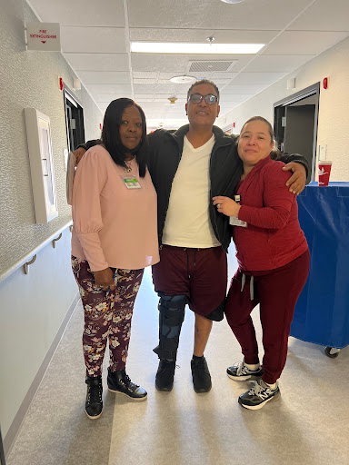A cheerful moment shared among friends in the hospital.