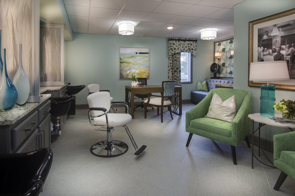 A modern and stylish hair salon interior with comfortable seating and elegant decor.
