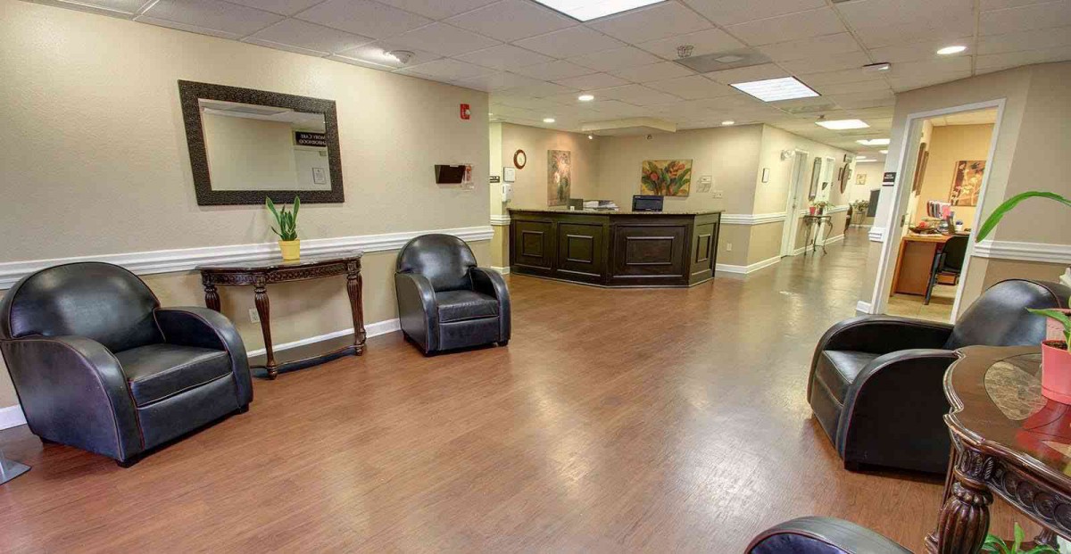 A spacious and welcoming reception area with comfortable seating and a front desk.
