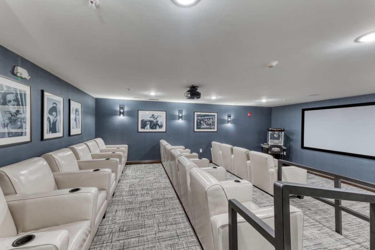 A spacious home theater with comfortable seating and modern decor.