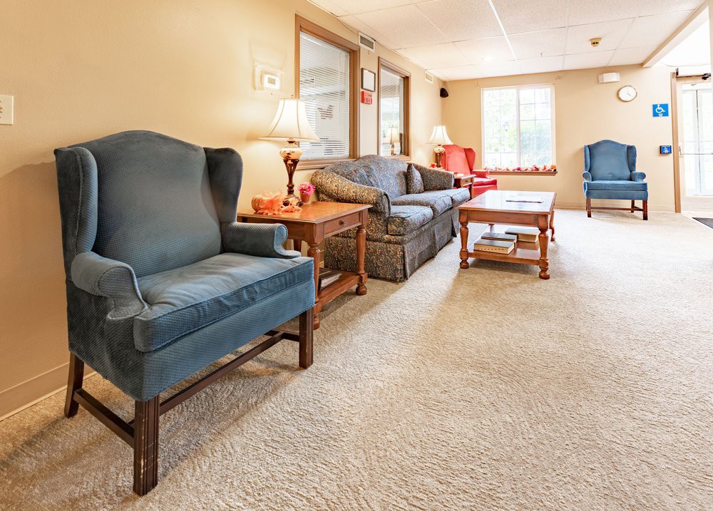 A cozy living room with comfortable seating and warm lighting.