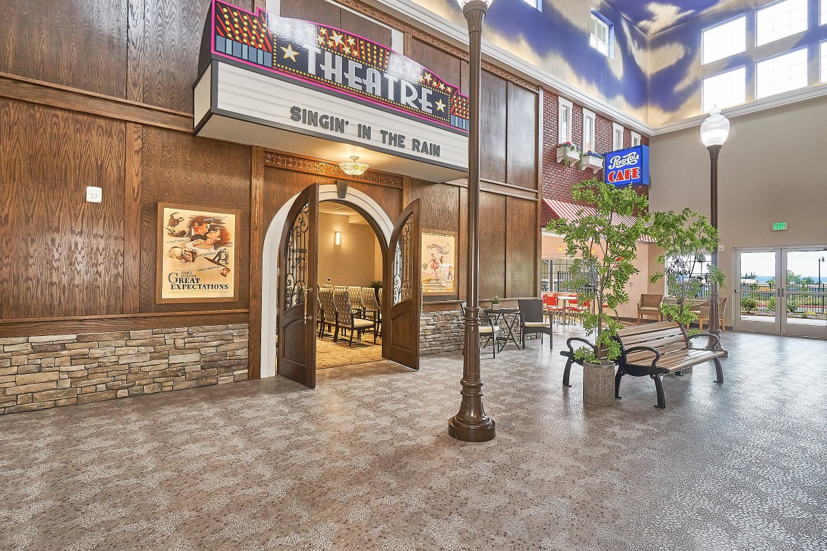 An inviting theater entrance with classic marquee and indoor seating.