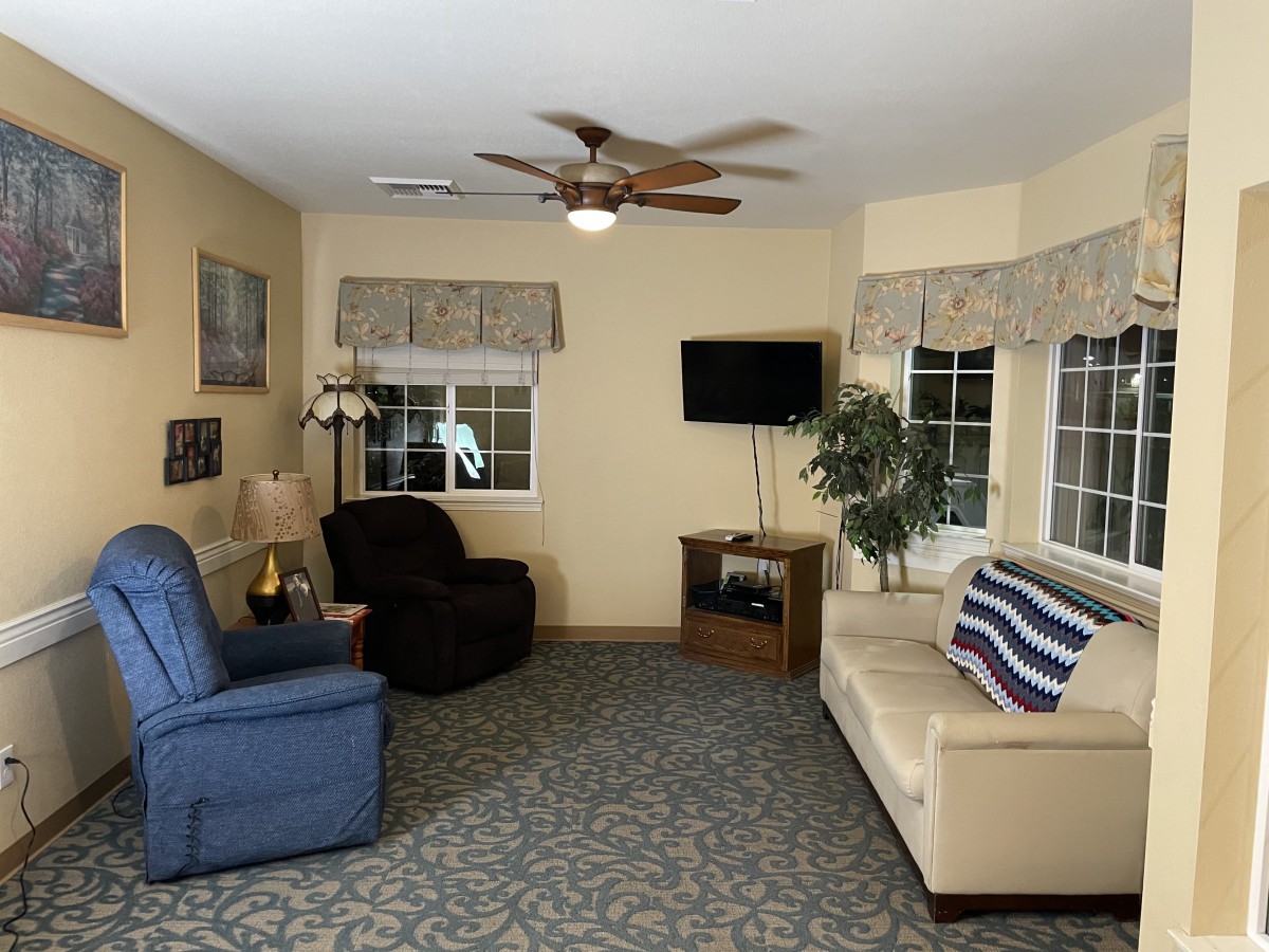 A cozy living room with comfortable seating and a television.
