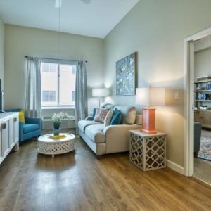 A cozy living room with comfortable seating and elegant decor.