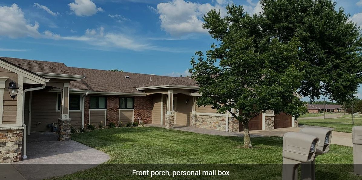 Suburban house with a front porch and a personal mailbox.