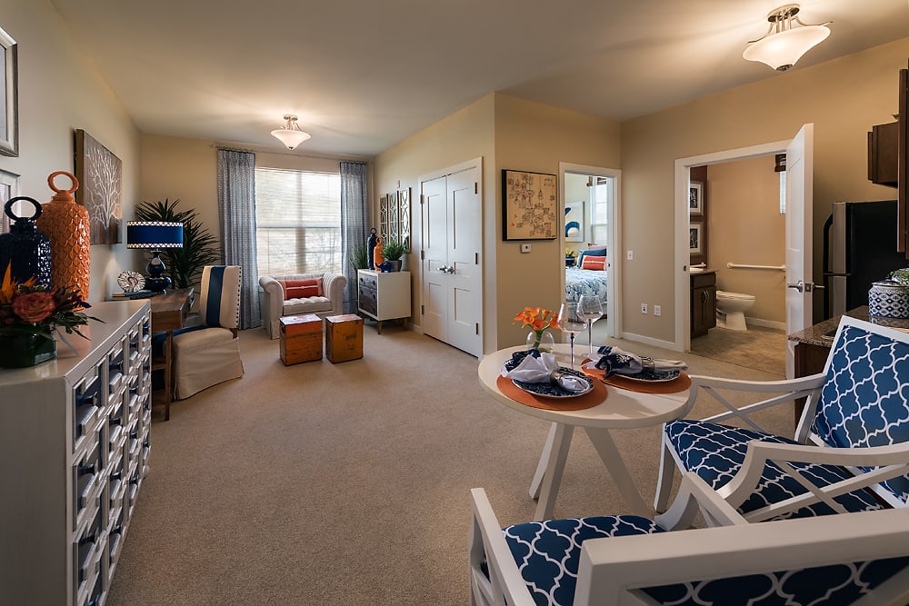A modern apartment interior featuring a cozy living room and dining area.