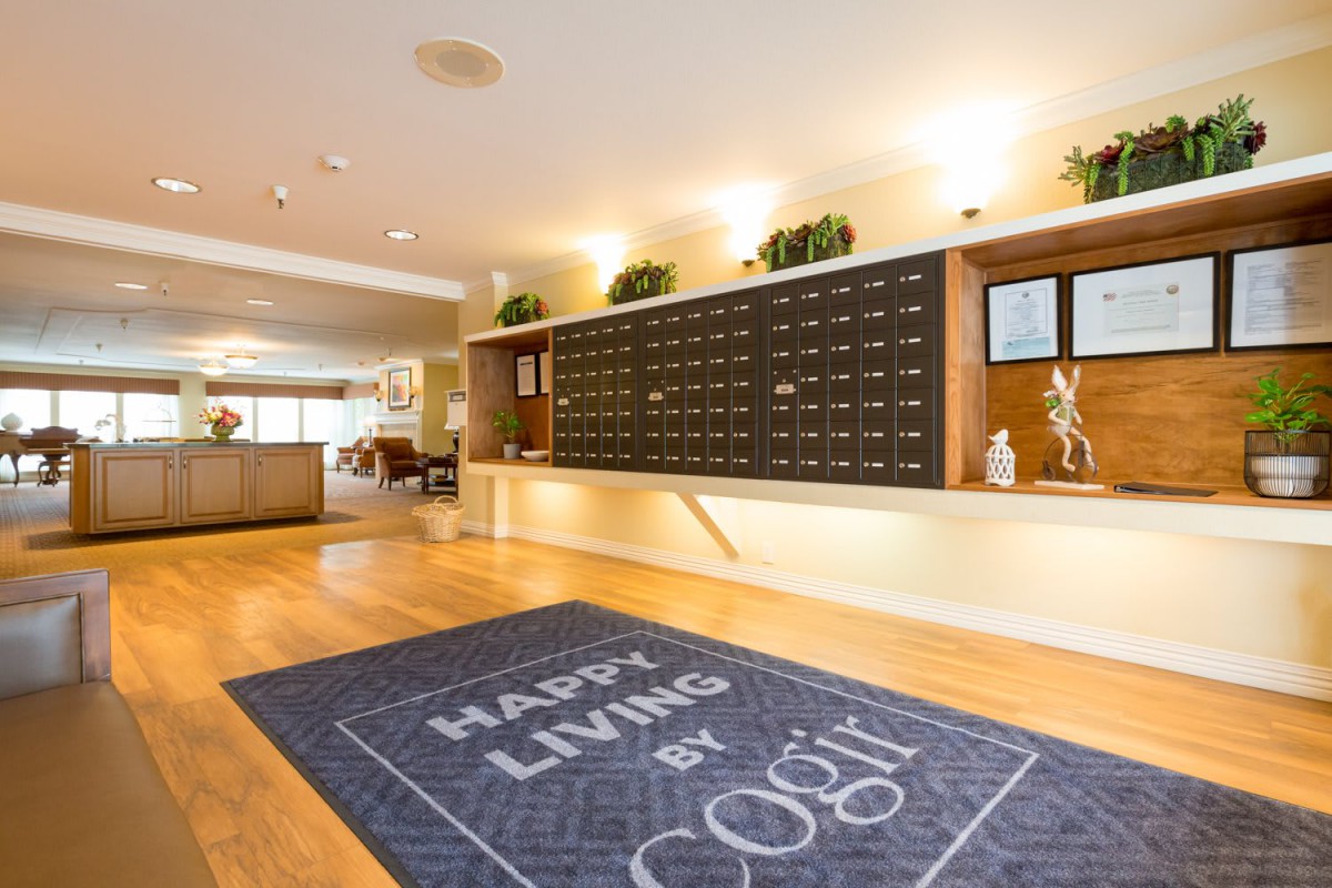 A welcoming lobby interior featuring a large mail area and decorative elements.