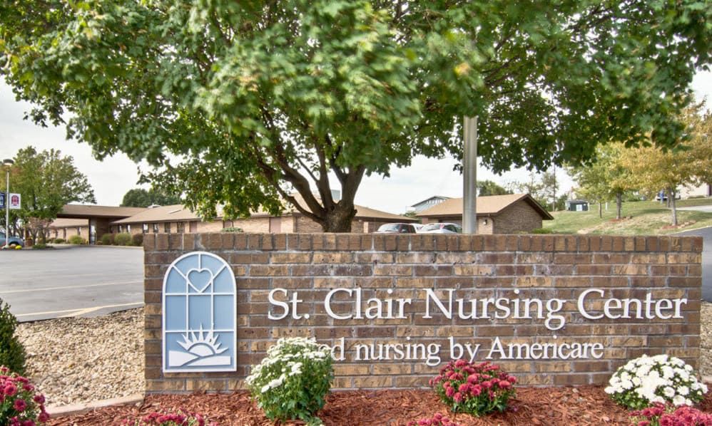 Entrance sign for St. Clair Nursing Home with surrounding landscaping.