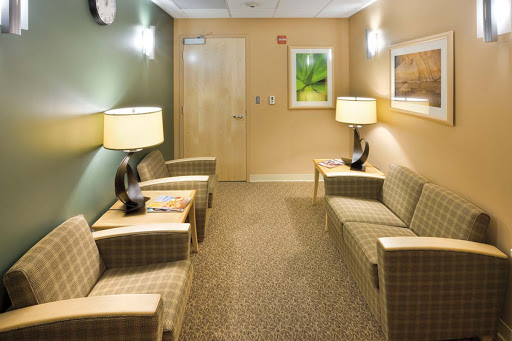 A calm and inviting waiting room with comfortable seating and soft lighting.