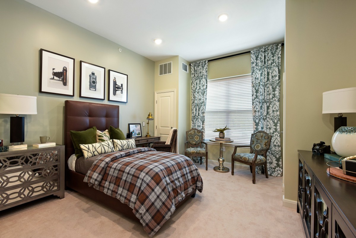 A modern bedroom with stylish decor and comfortable furnishings.