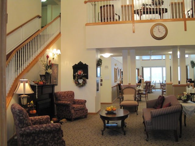 A spacious living room with comfortable seating and elegant decor.