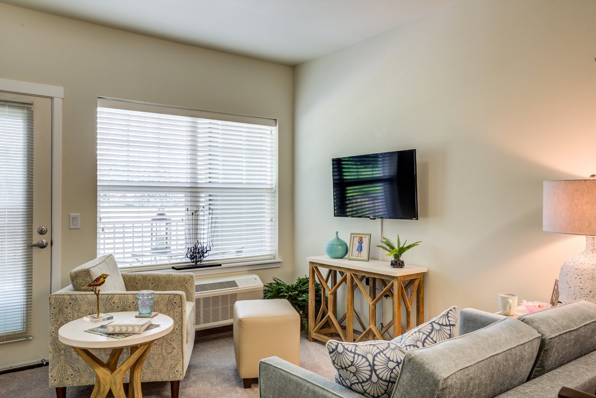 A modern living room with comfortable seating and stylish decor.