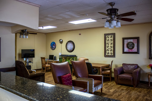 A cozy lounge area featuring comfortable seating and a warm atmosphere.