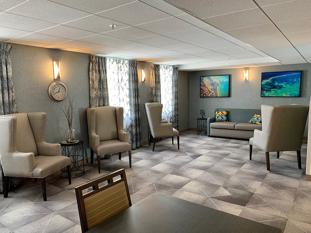 A modern waiting room with comfortable seating and stylish decor.
