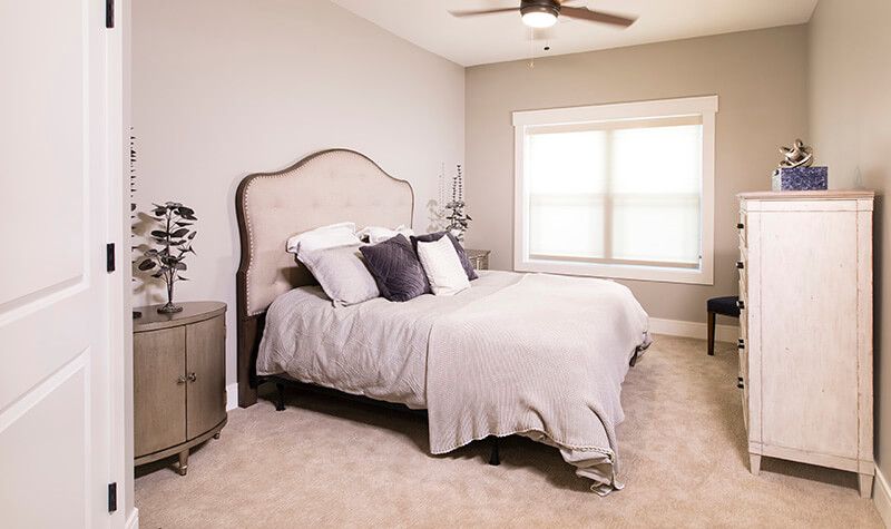 A cozy, modern bedroom with a comfortable bed and elegant decor.