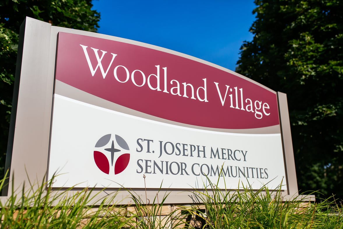 Sign for Woodland Village, a St. Joseph Mercy Senior Community.