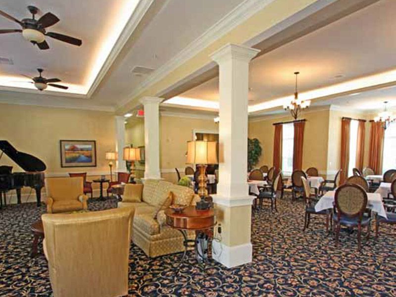 A cozy living room with elegant furnishings and warm lighting.