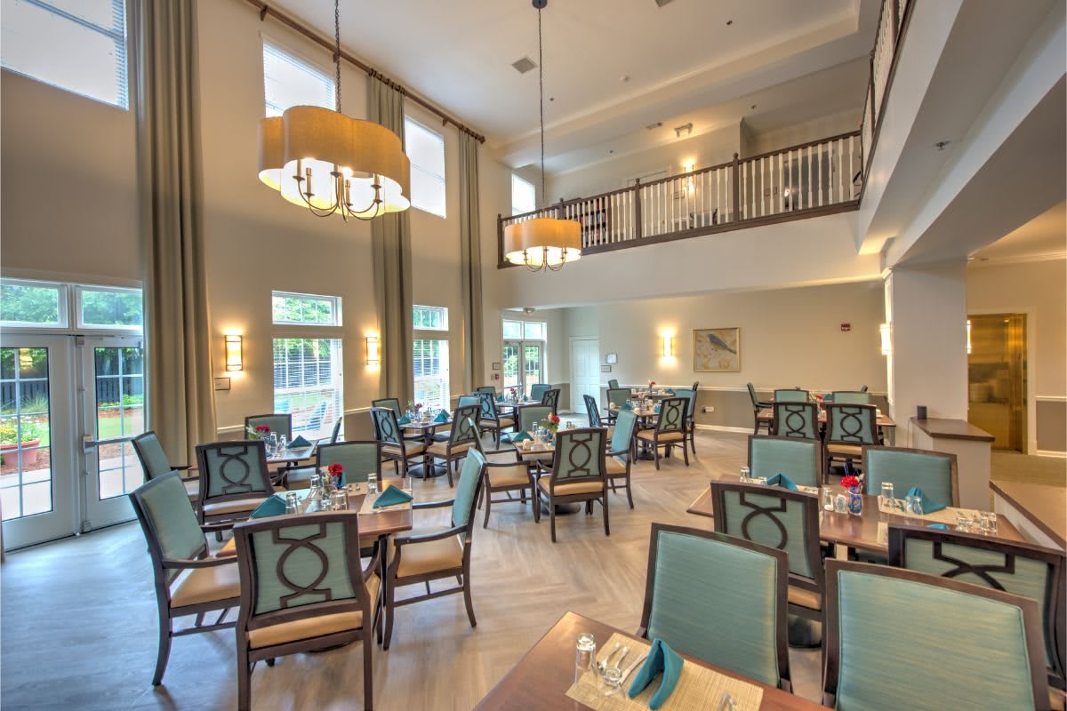 Elegant dining area with stylish chandeliers and a spacious layout.