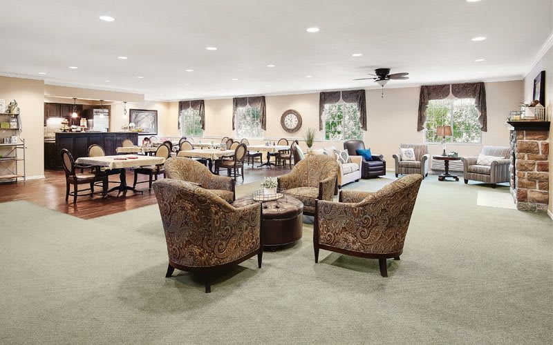 A spacious living room with comfortable seating and elegant decor.