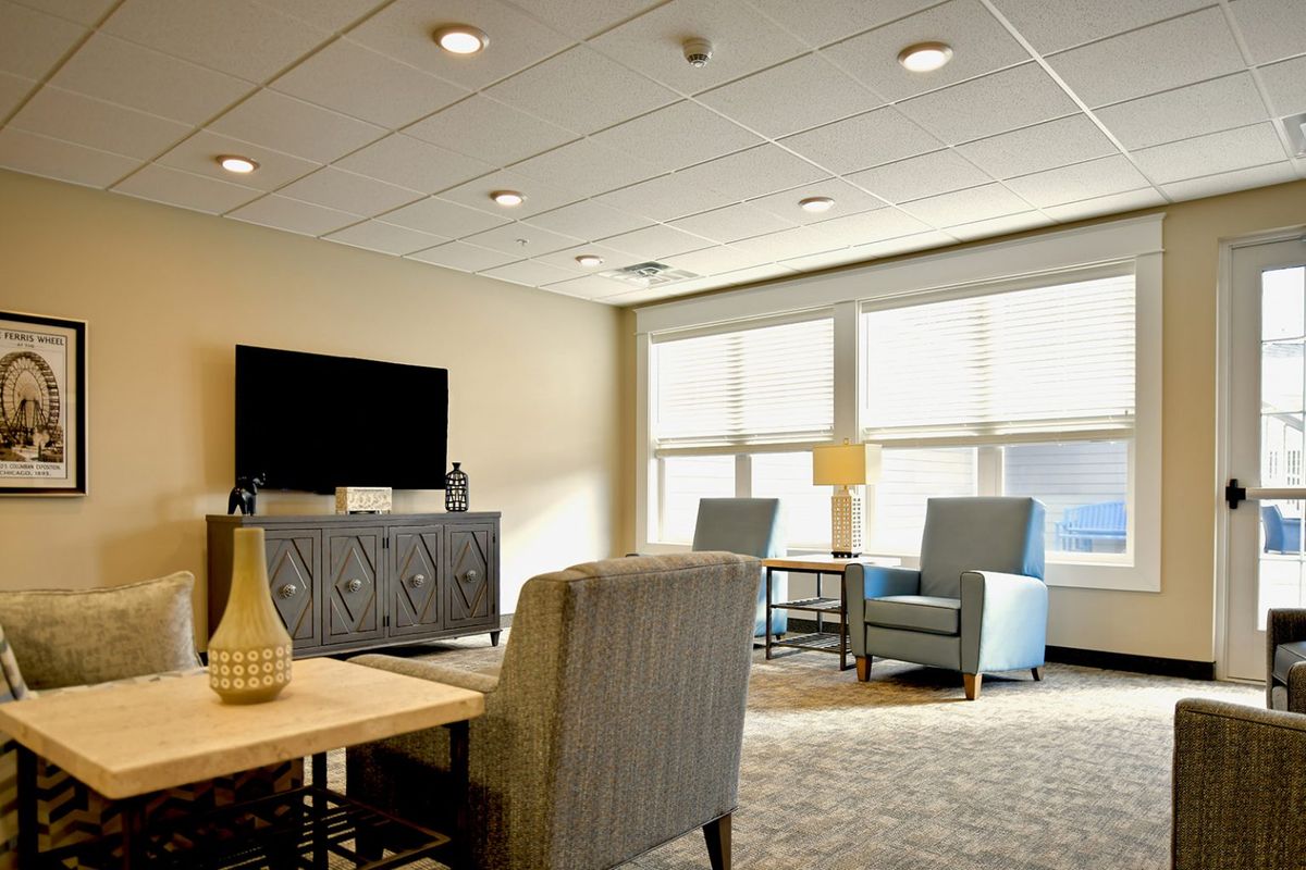 A modern living room with comfortable seating and ample natural light.
