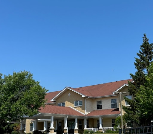 A charming residential building under a clear blue sky.