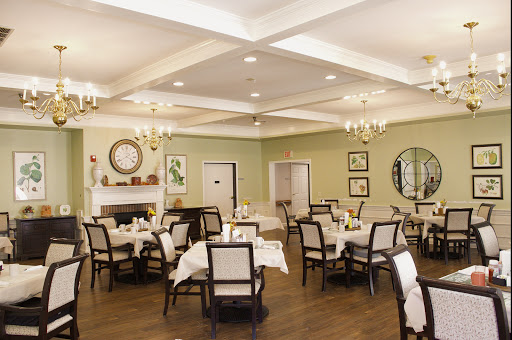 A cozy and elegantly designed dining area with well-set tables, perfect for a comfortable dining experience.