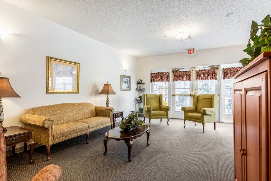 A cozy living room with vintage-style furniture and decor.