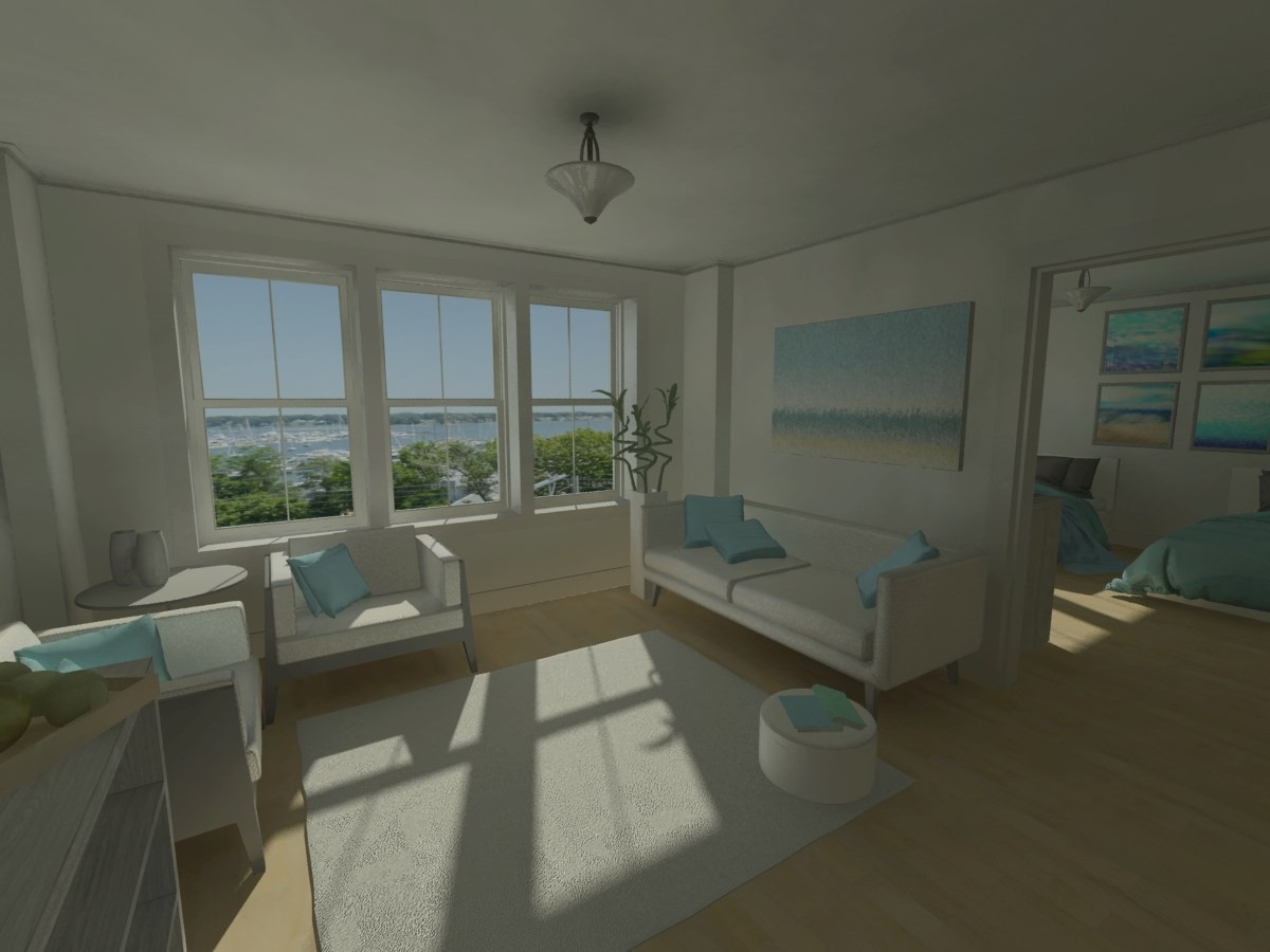 A bright, modern living room with large windows offering a stunning coastal view, featuring white and blue decor.