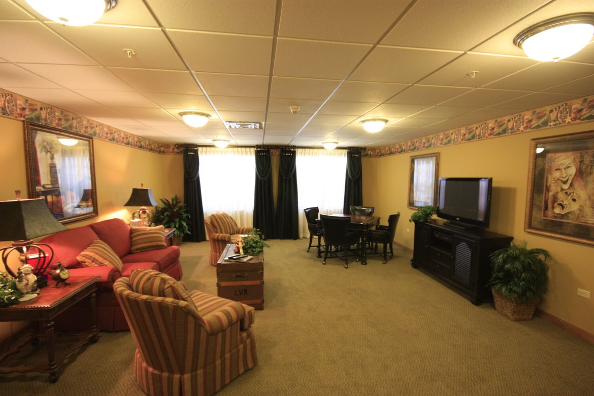 A cozy living room with comfortable seating and a television.