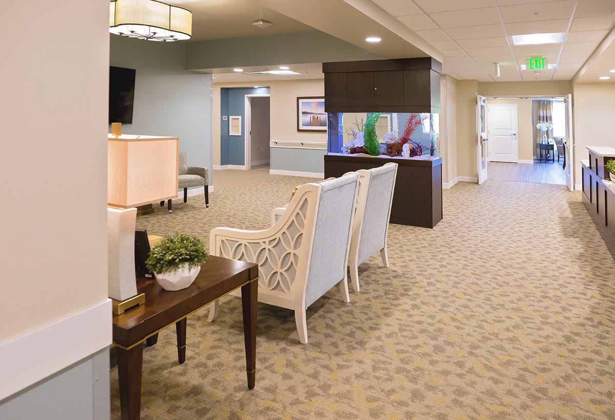 A spacious and elegantly decorated lobby area featuring comfortable seating and tasteful decor.