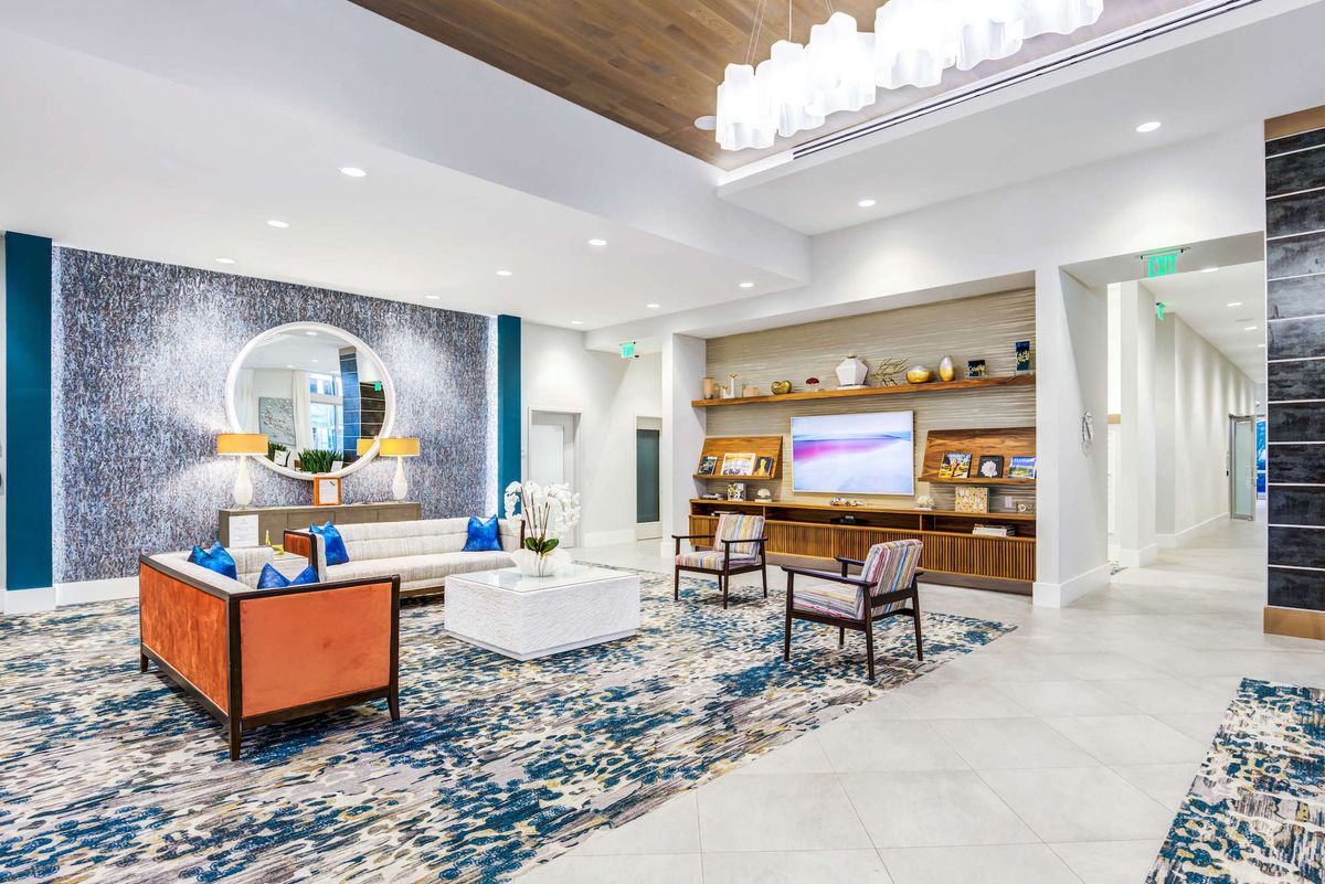 A modern lobby interior with stylish furniture and contemporary decor.