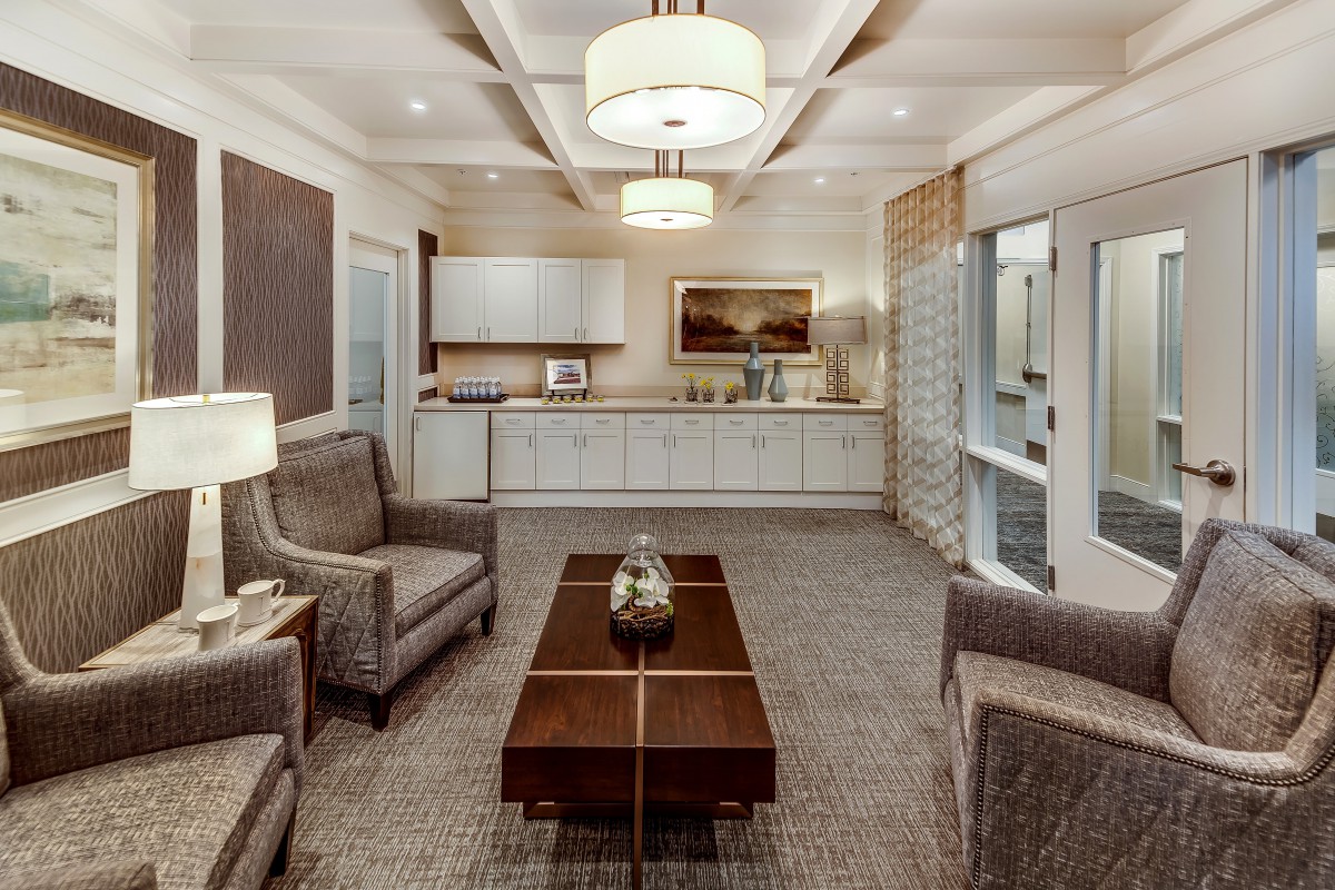 A modern living room with comfortable seating and elegant decor.