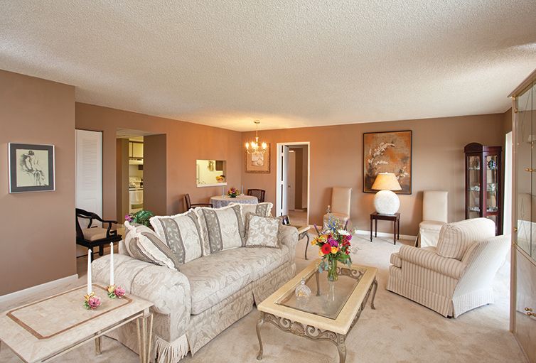 A cozy living room with elegant furniture and warm lighting.