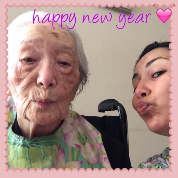 A joyful New Year selfie with an elderly family member.